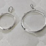 Round pendant made of 925 sterling silver with prong setting,...